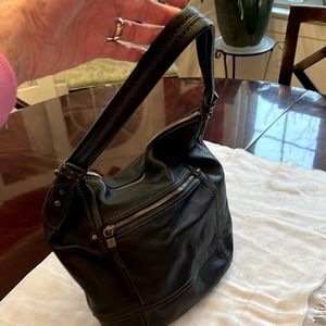 The Sak black pebbled leather hobo bag.